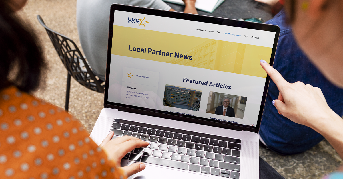 People viewing UMC’s Local Partner News webpage on a laptop, representing updates and collaboration with community partners